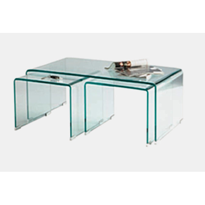 Set of three clear glass nesting tables on a white background