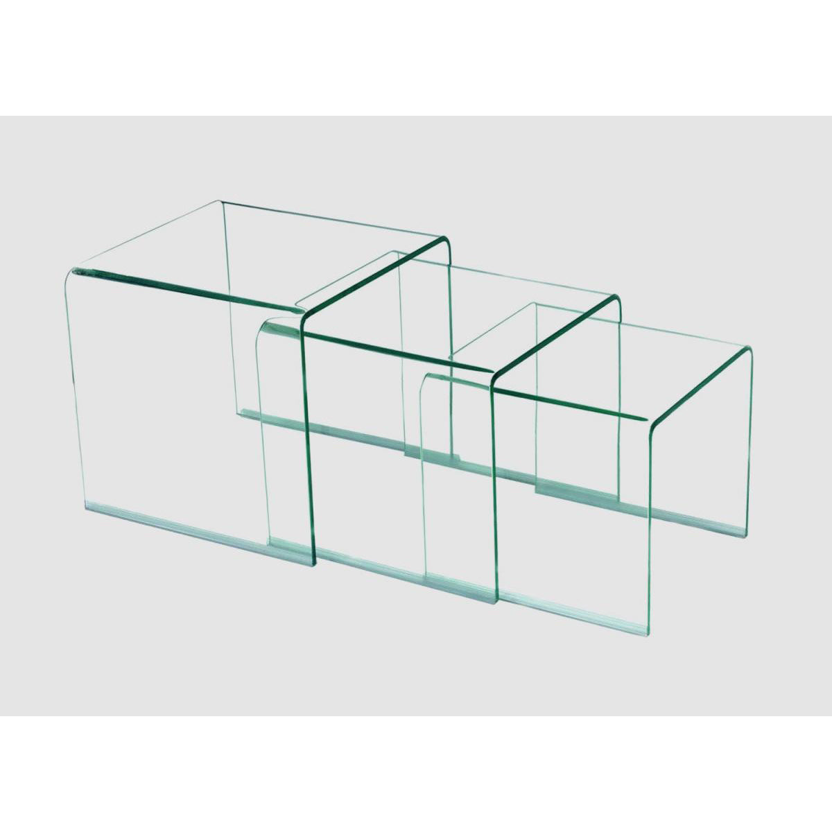 A set of three clear glass tables in varying sizes, displayed in a nesting fashion.