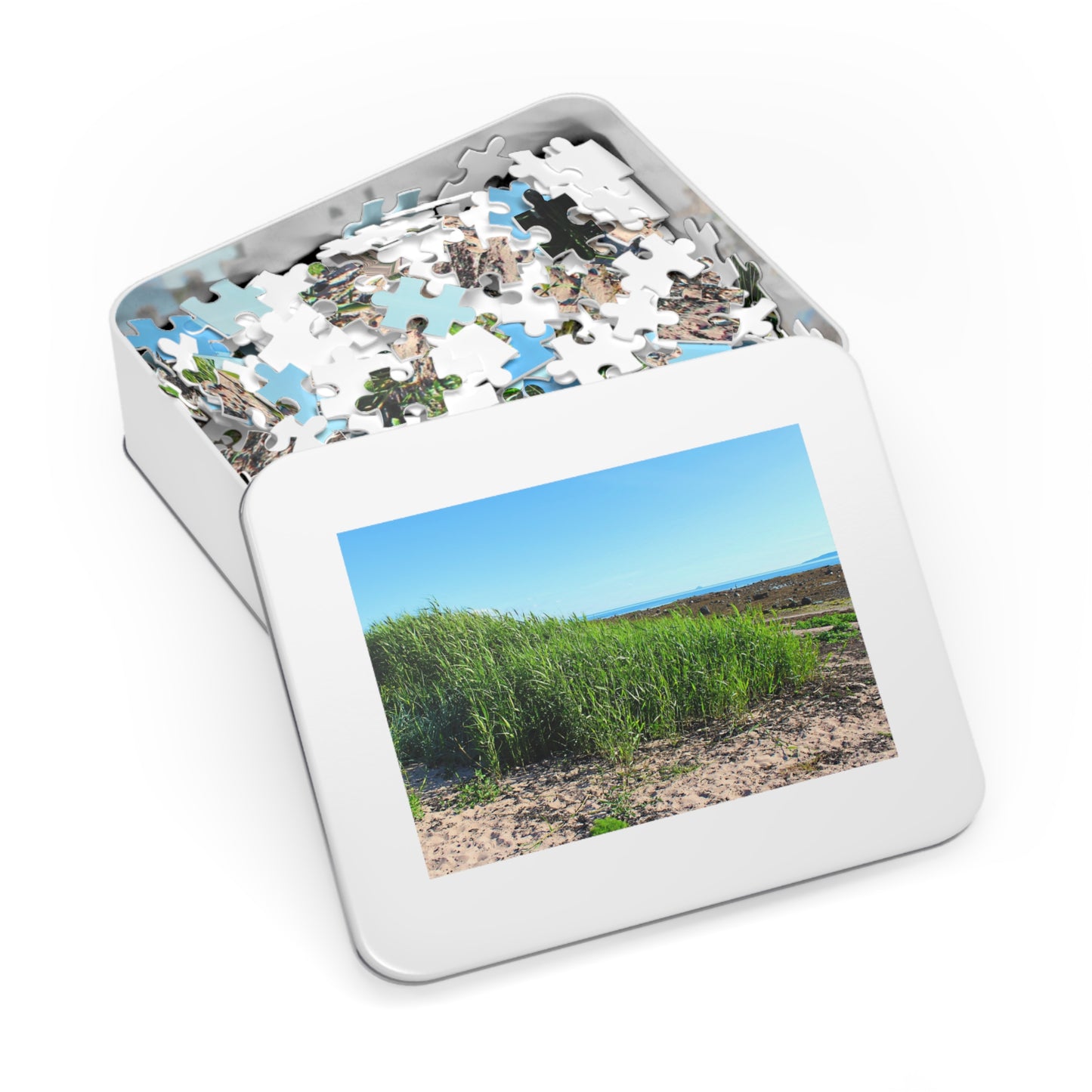 Jigsaw puzzle in a tin with a scenic picture on the lid