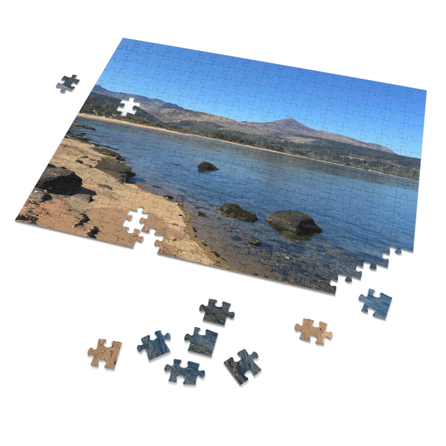 Jigsaw puzzle of a beach scene with missing pieces on a white background