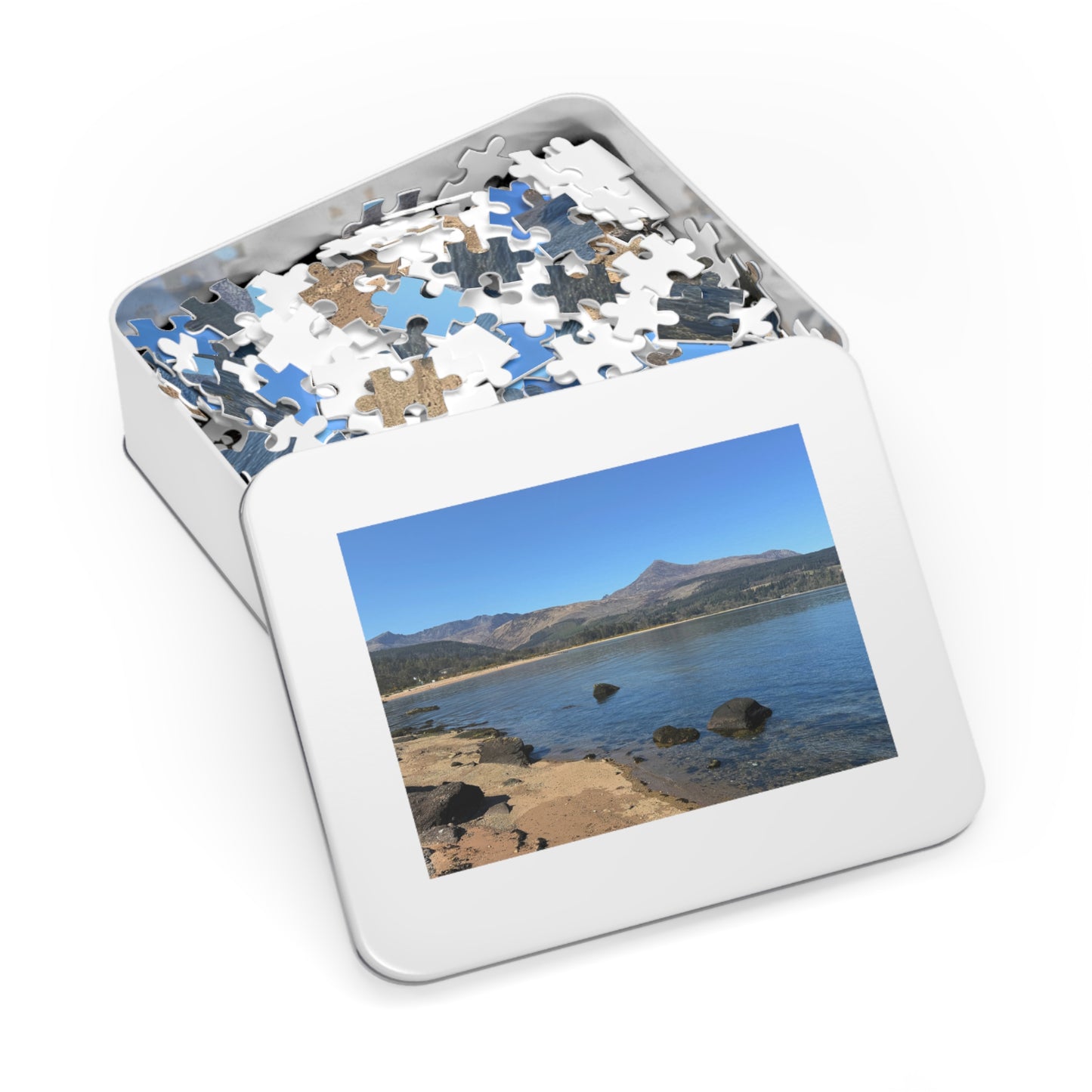 Jigsaw puzzle in a tin with a scenic picture on the lid
