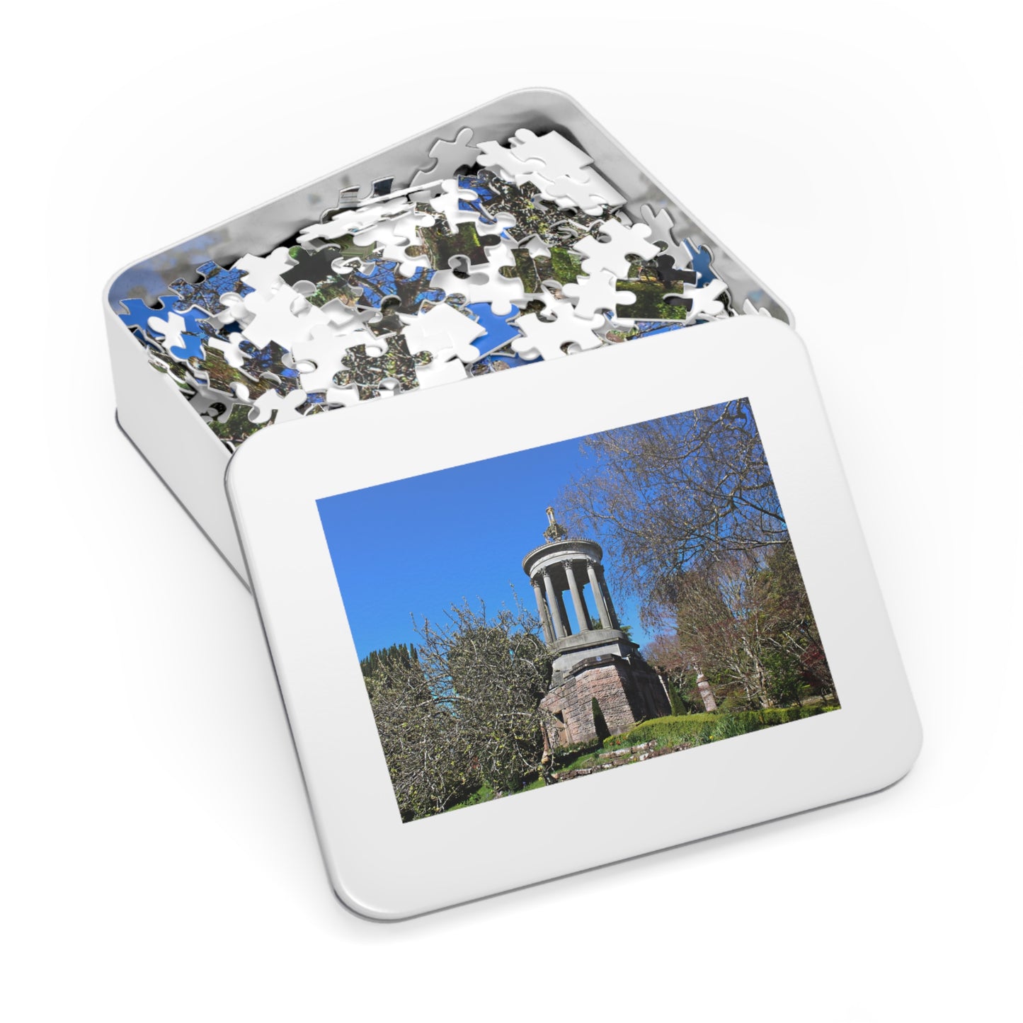Jigsaw puzzle in a tin with a scenic cover
