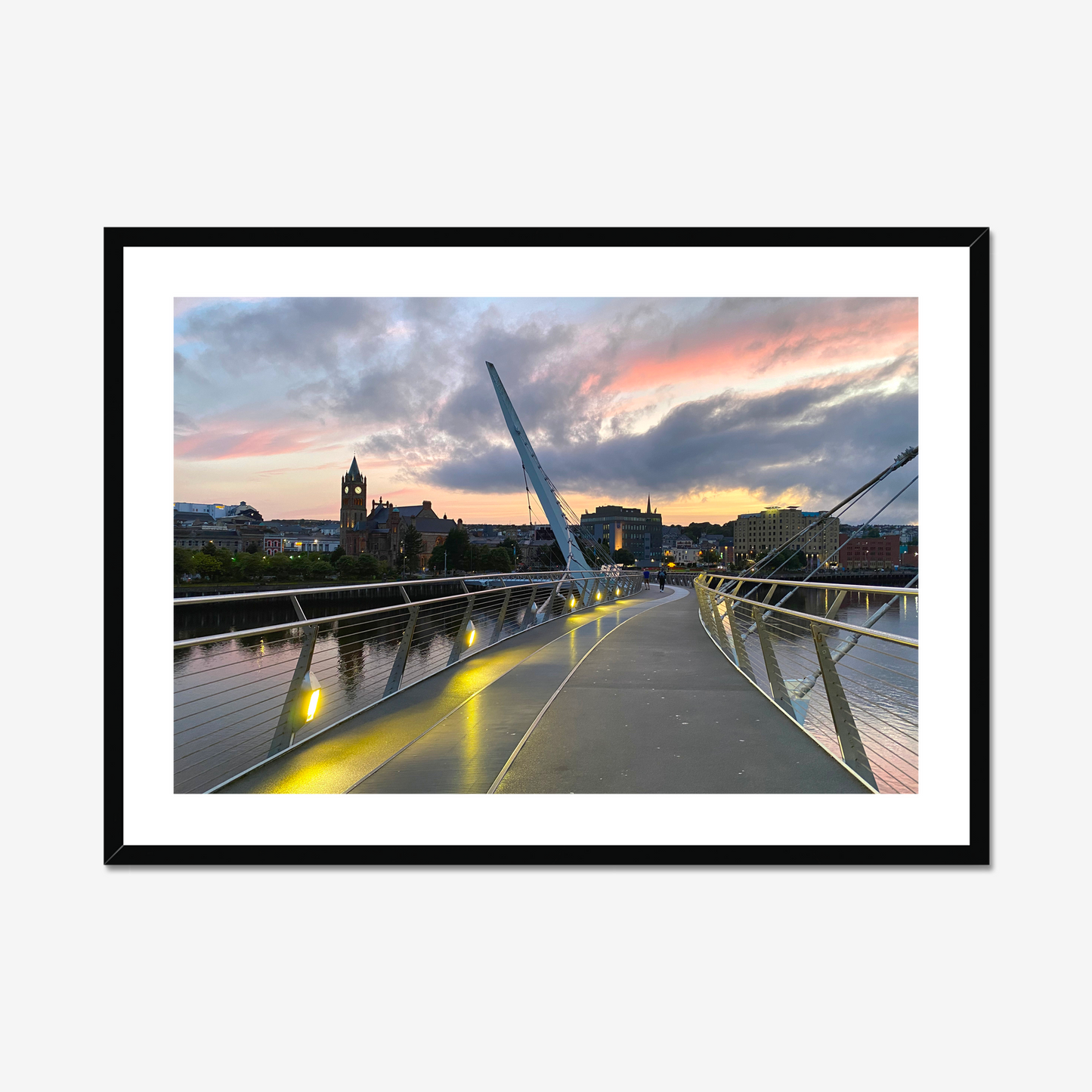 Framed photograph of a cityscape with a modern bridge at sunset.
