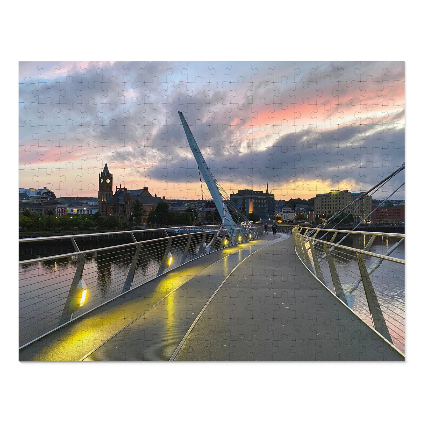 Modern bridge with a cityscape and sunset sky