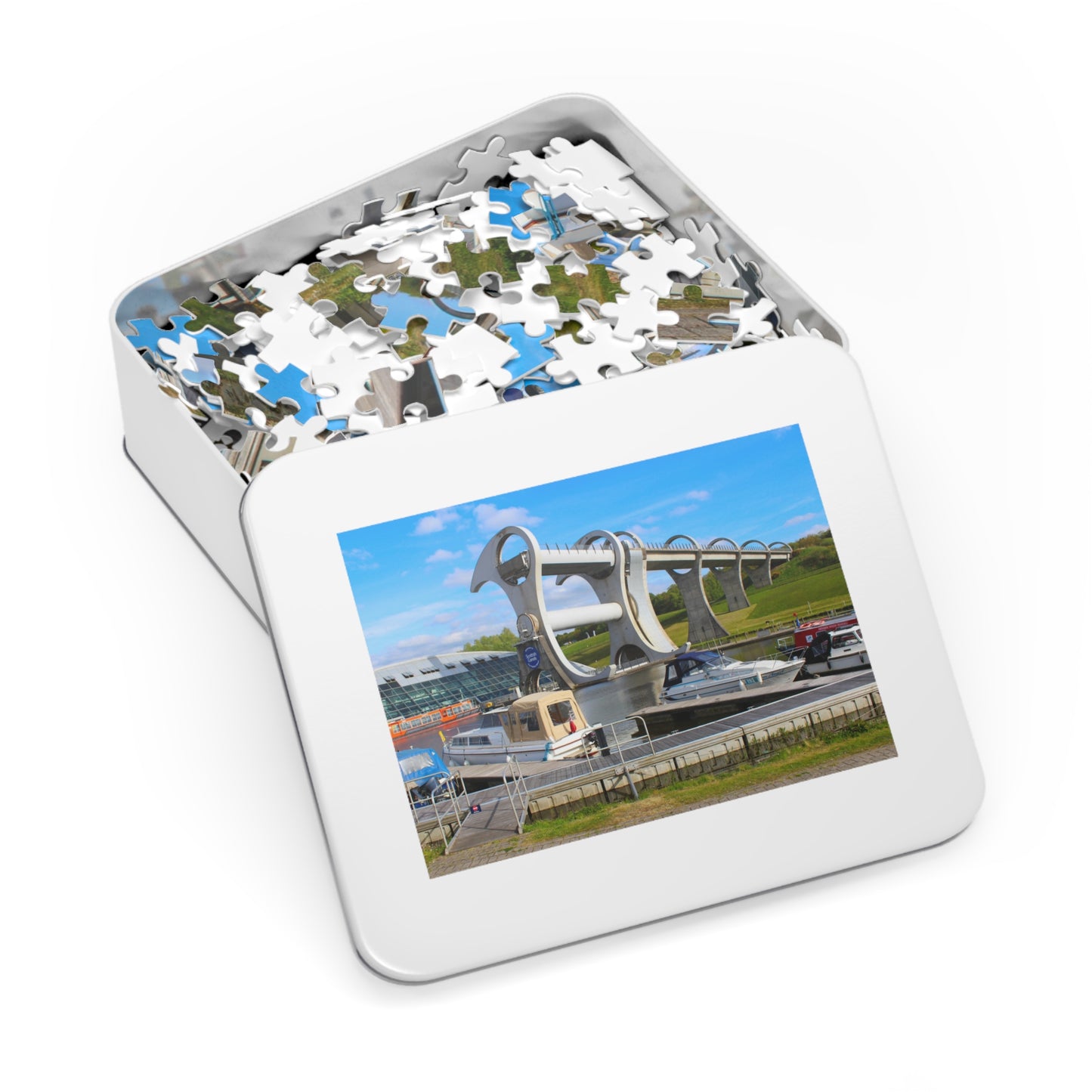 Jigsaw puzzle in a tin with a scenic image of a bridge on the cover