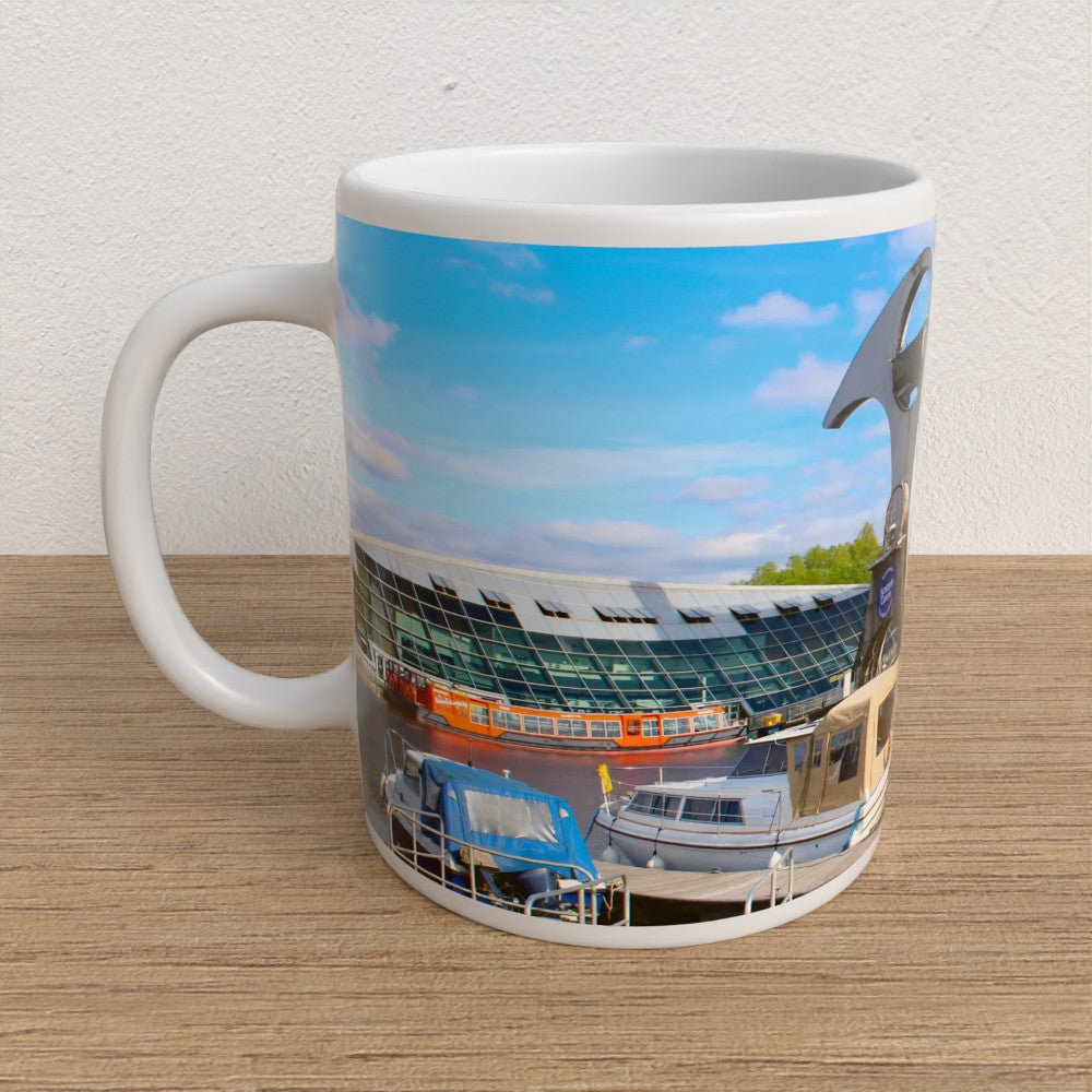 Mug with a boat lift on a wooden surface