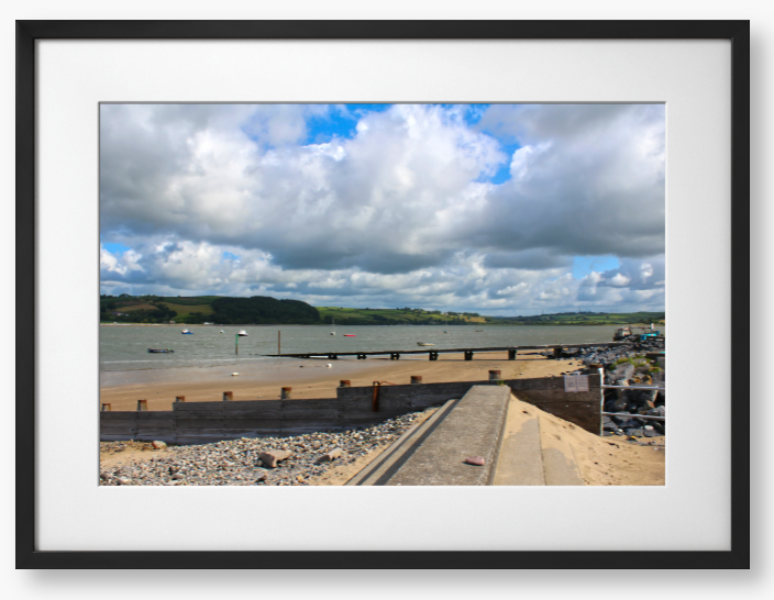 Framed Photo of a Beach scene with a large body of water, sky with clouds, and distant hills.