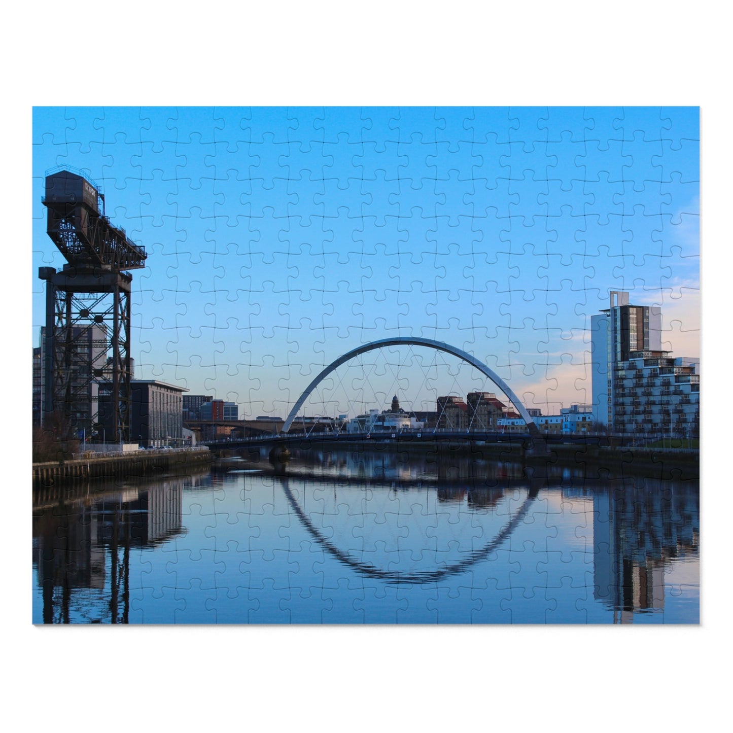 Jigsaw puzzle with a cityscape featuring a bridge and skyline.
