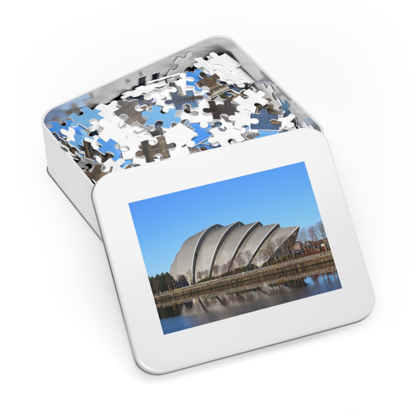 Jigsaw puzzle in a box with a picture of a building on the cover