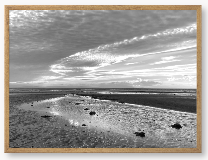 Framed Black and White Photo of a coastal landscape with a cloudy sky