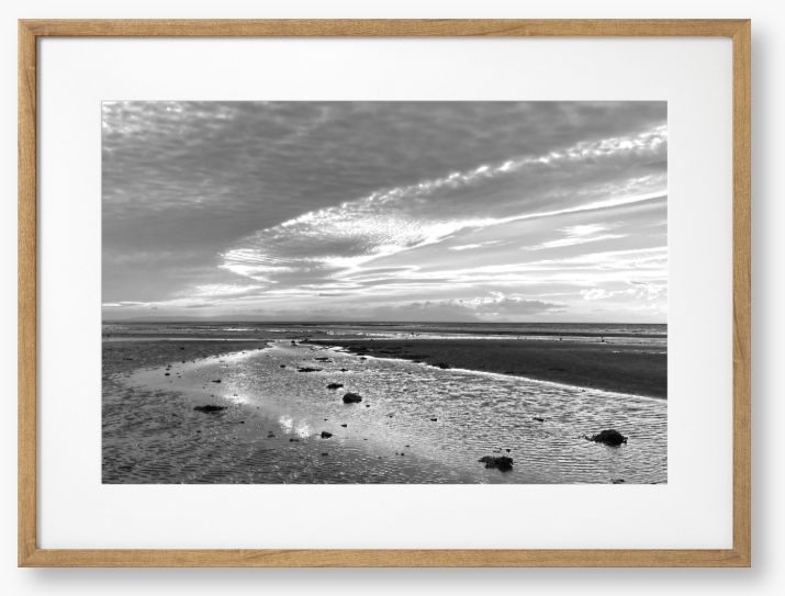 Framed Black and White Photo of a coastal landscape with a cloudy sky