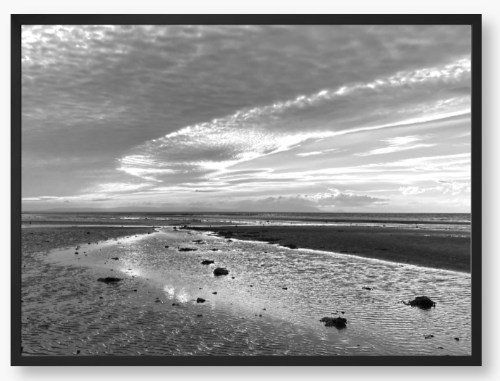 Framed Black and White Photo of a coastal landscape with a cloudy sky
