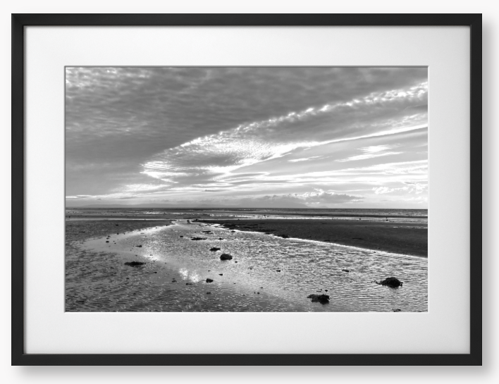 Framed Black and White Photo of a coastal landscape with a cloudy sky