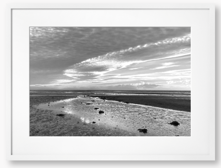Framed Black and White Photo of a coastal landscape with a cloudy sky