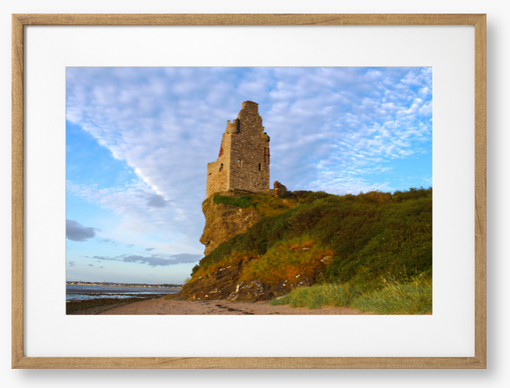 Framed Photo of Ruins of a tower on a cliff with a blue sky and clouds in the background