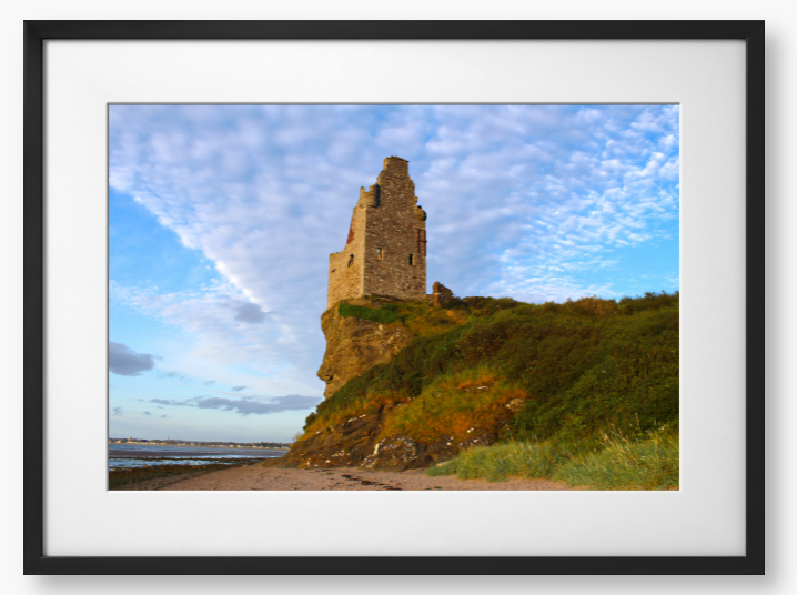 Framed Photo of Ruins of a tower on a cliff with a blue sky and clouds in the background