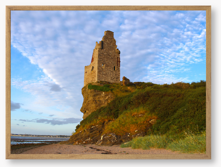 Framed Photo of Ruins of a tower on a cliff with a blue sky and clouds in the background