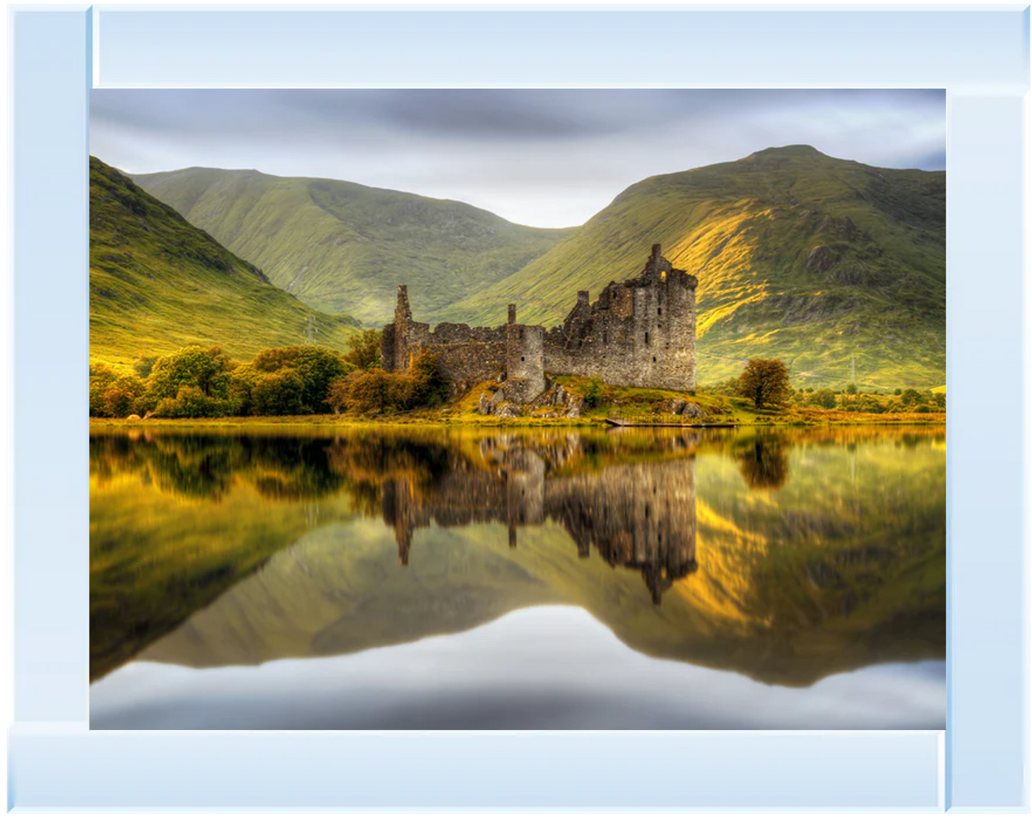 Mirror framed wall art with a castle reflected in a lake with mountains in the background.