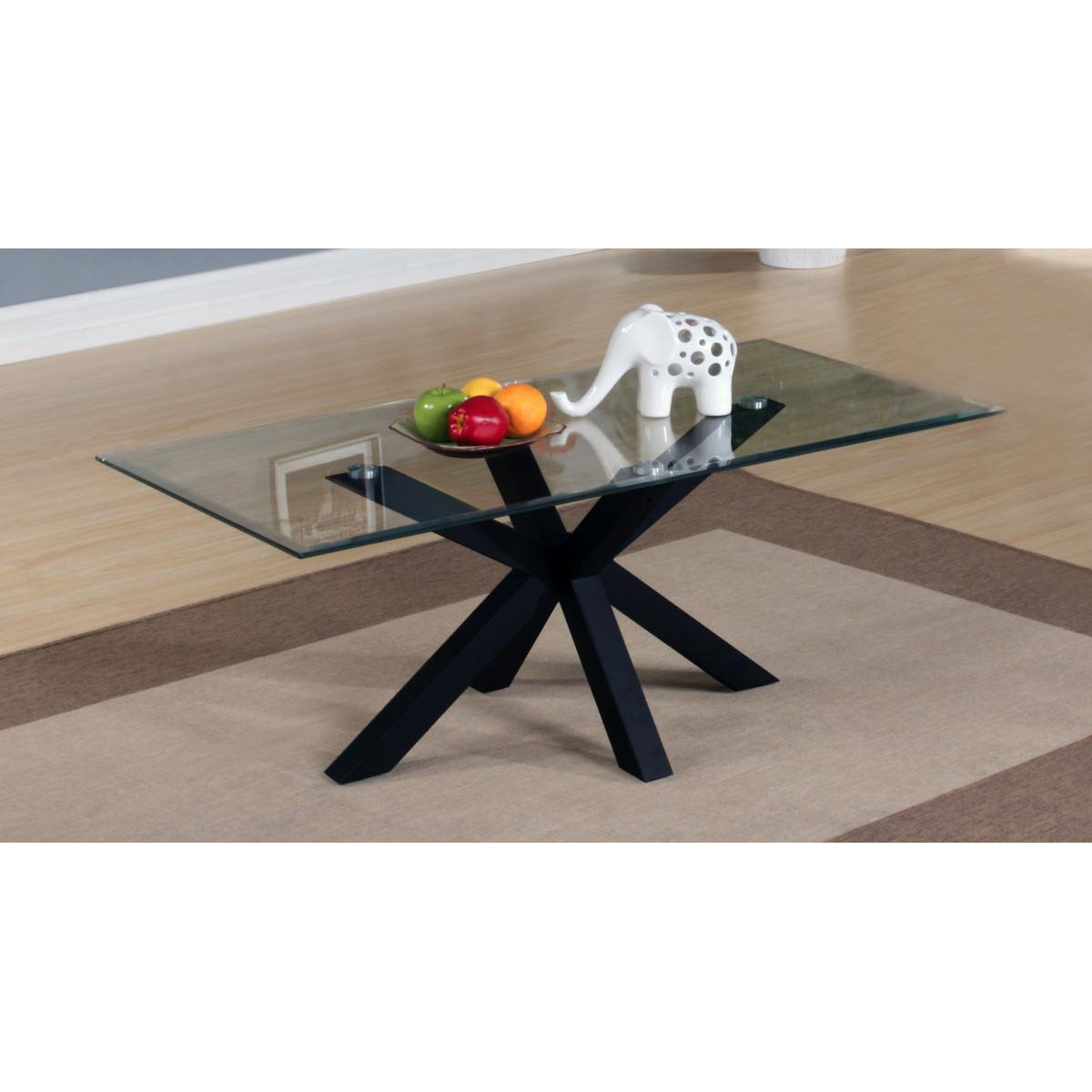 A black glossy coffee table with a clear glass top, featuring a minimalist design. The table is rectangular and positioned on a carpeted floor.