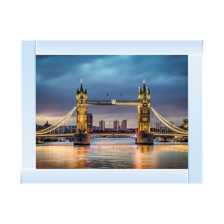 Framed picture of Tower Bridge in London at dusk with a silver mirror frame.