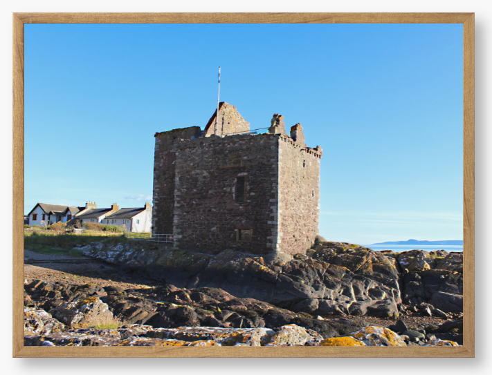 Framed Photo of a Stone castle on rocky terrain with a clear blue sky