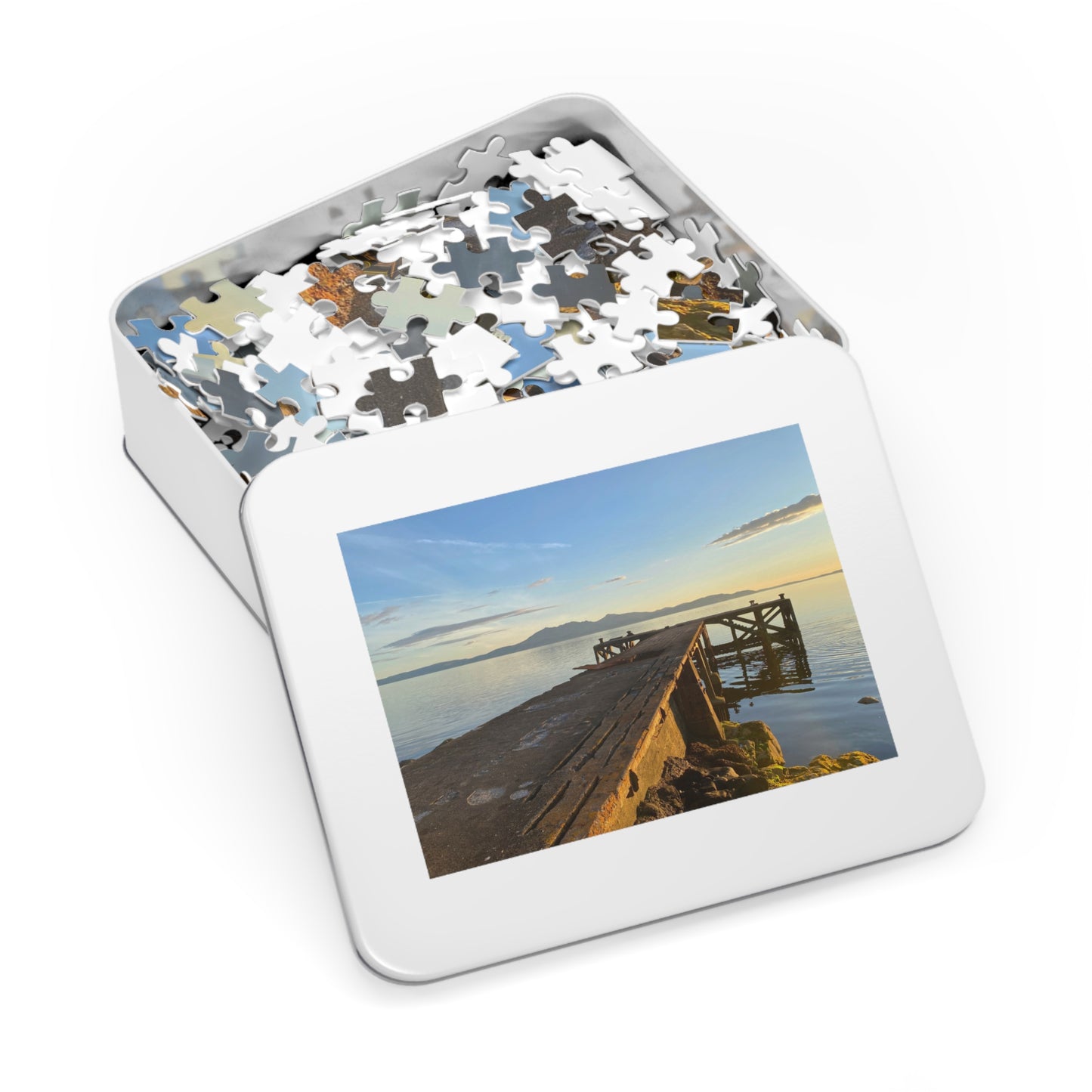 Jigsaw puzzle in a tin box with a scenic cover