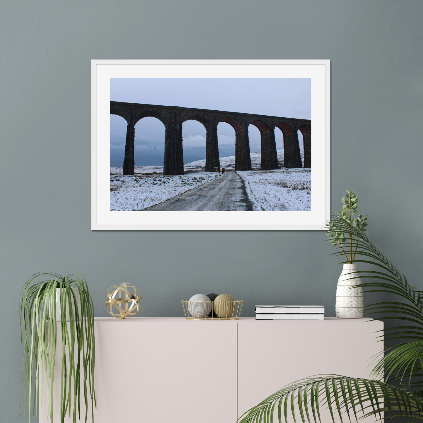 Framed photograph featuring the Ribblehead Viaduct in winter with snow on the ground and a cloudy sky.