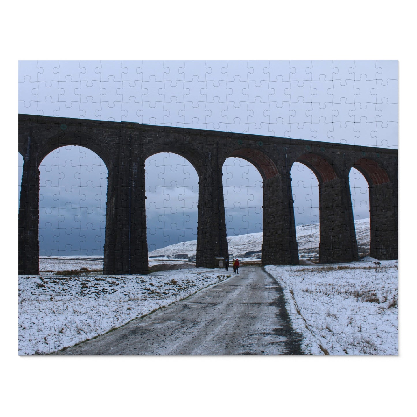 Jigsaw puzzle with a scenic view of a railway viaduct in a snowy landscape.