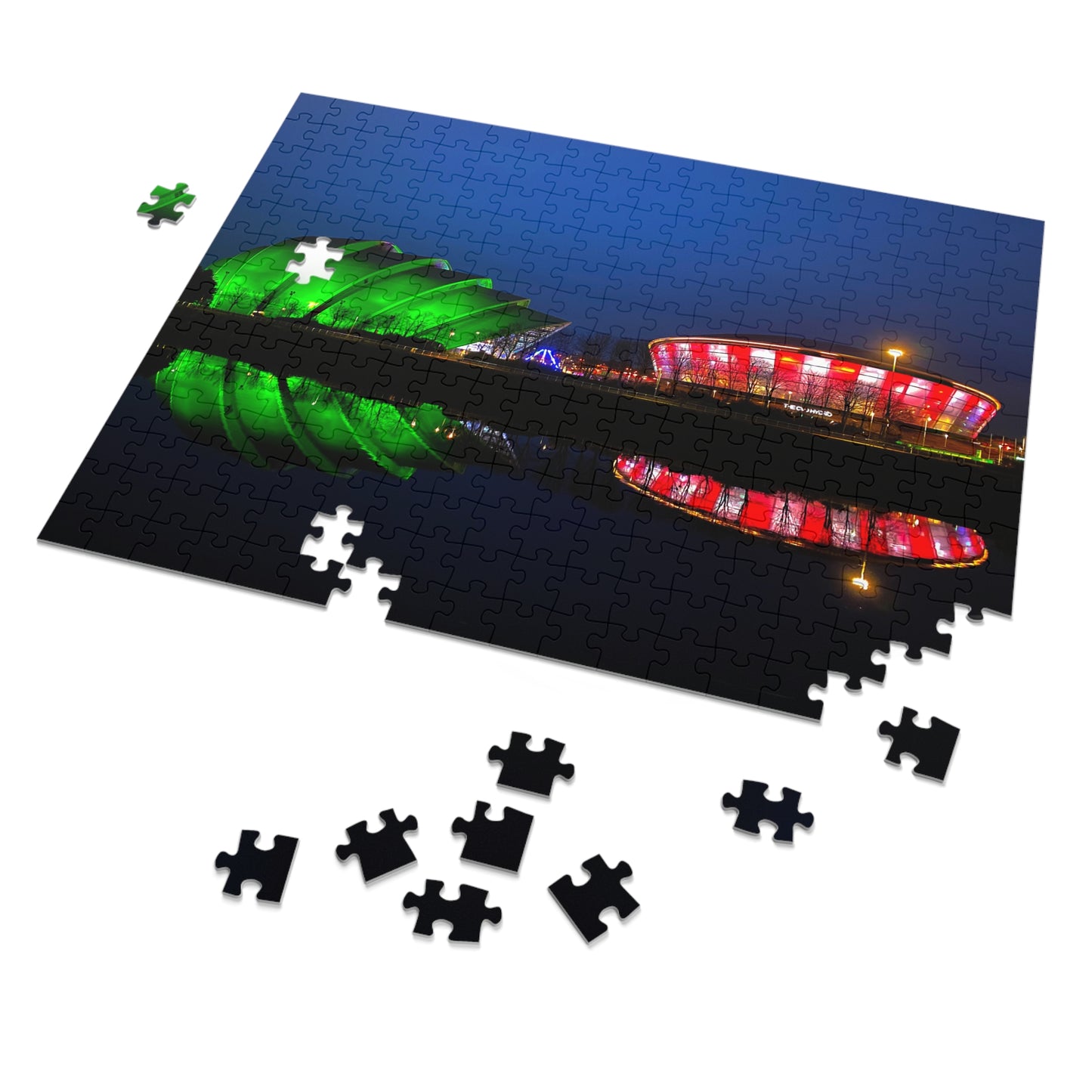 Jigsaw puzzle with completed pieces and missing ones, featuring a colourful stadium at night.