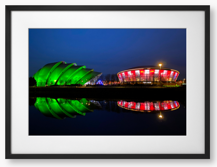 Framed Photo featuring the Glasgow SEC Armadillo and Hydro buildings lit up at night, reflected in the water of the Clyde.
