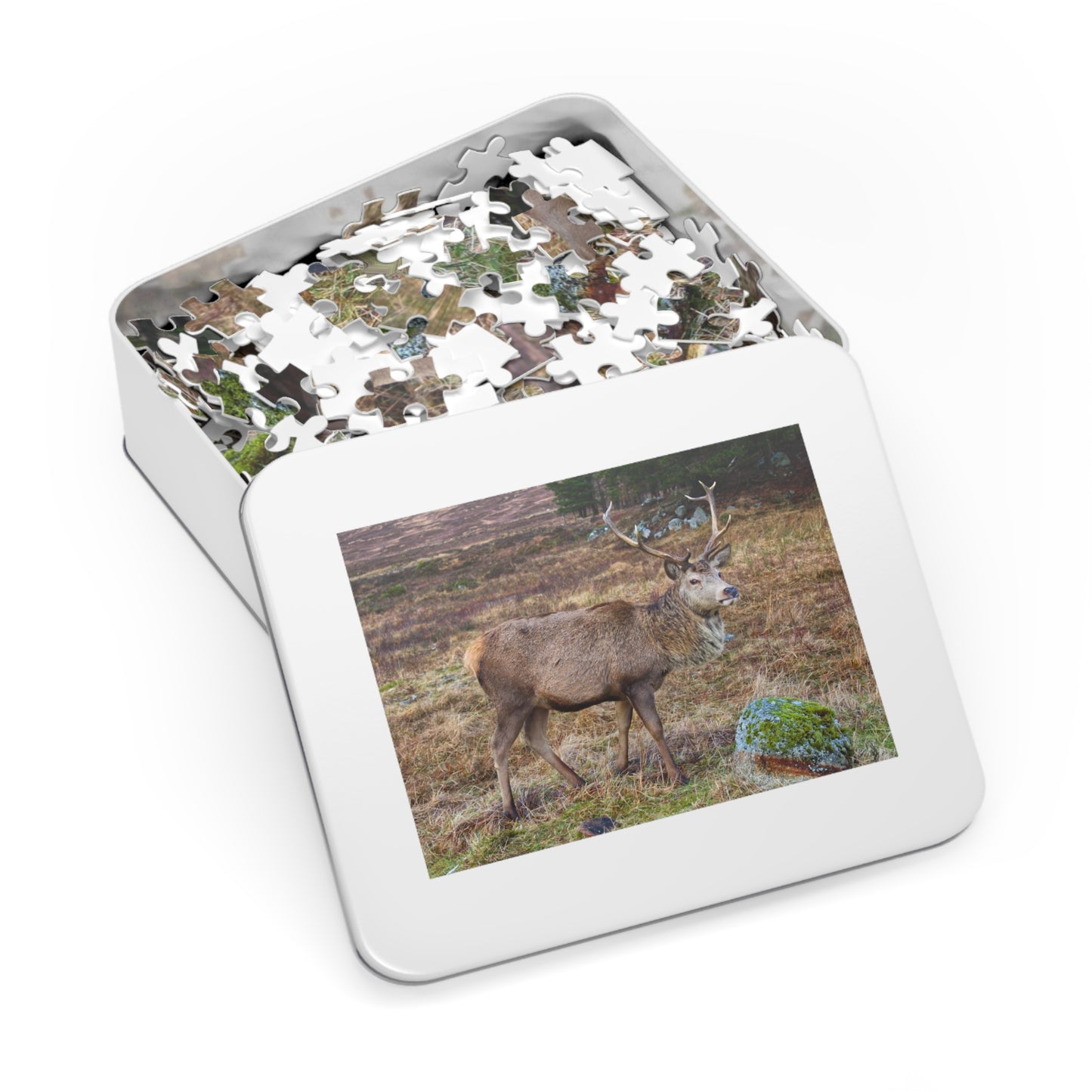 Jigsaw puzzle of a deer in a tin box with a picture of a deer on the lid.