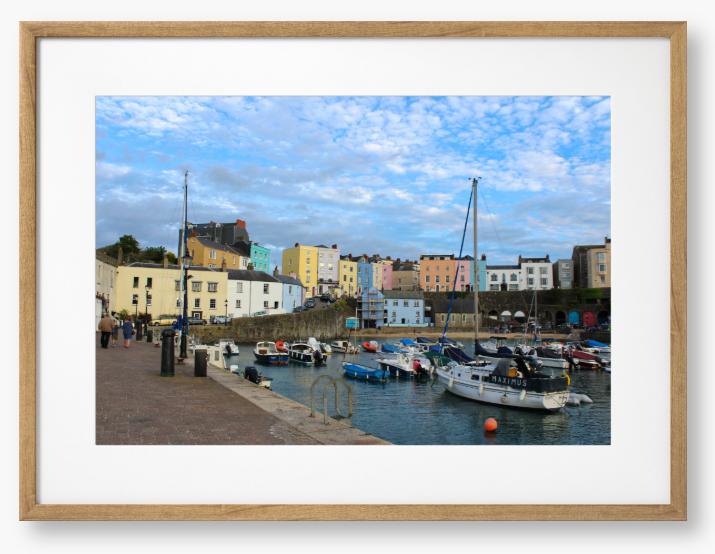 Framed Photo of a Harbour scene with colourful buildings and boats under a blue sky