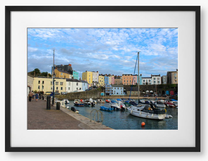 Framed Photo of a Harbour scene with colourful buildings and boats under a blue sky