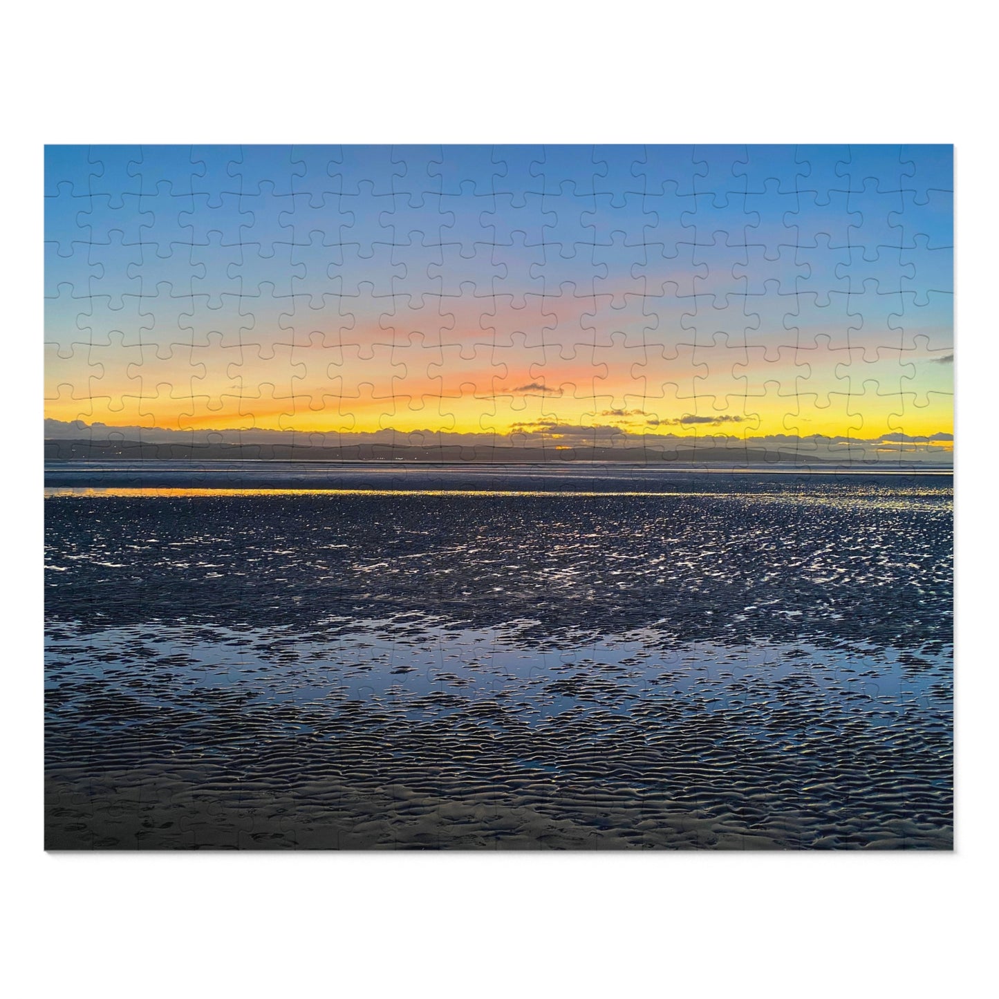 Jigsaw puzzle with a sunset over water design