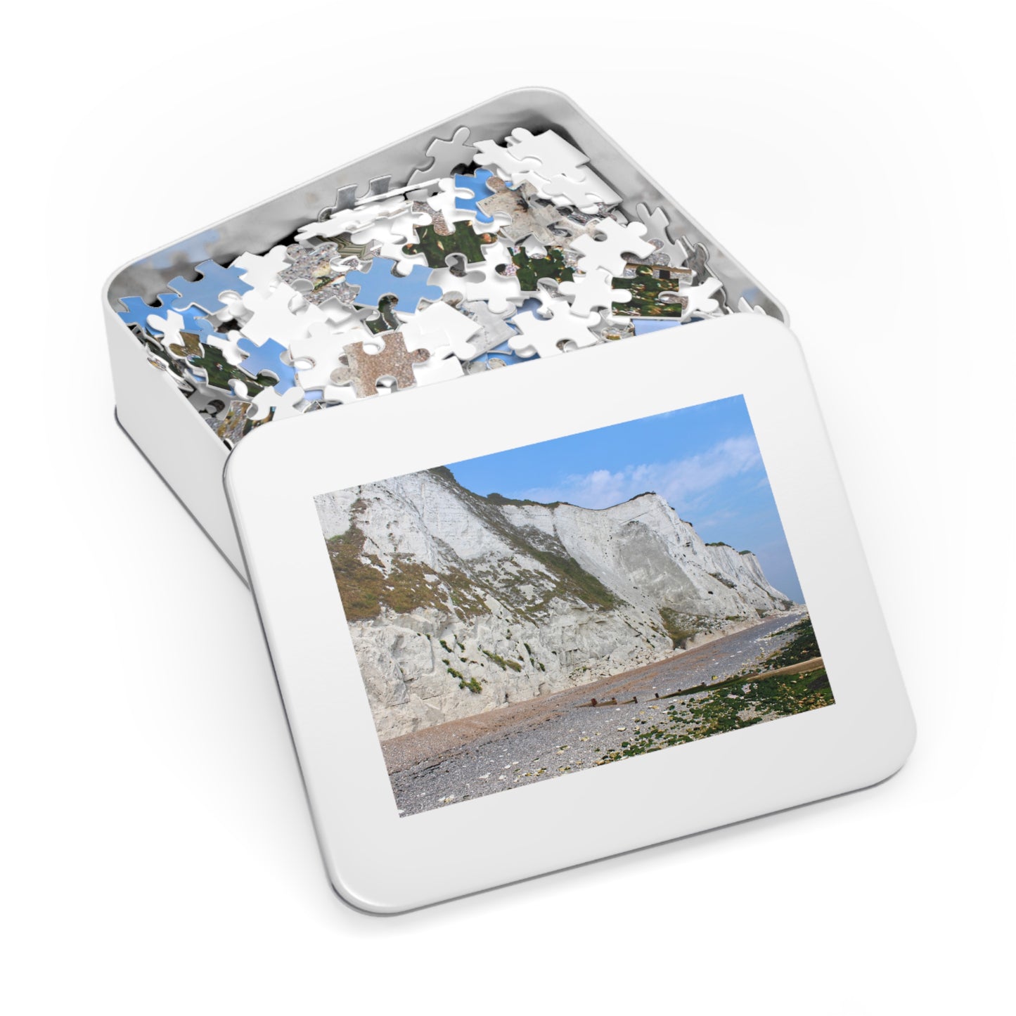 Jigsaw puzzle in a tin with a scenic picture on the lid