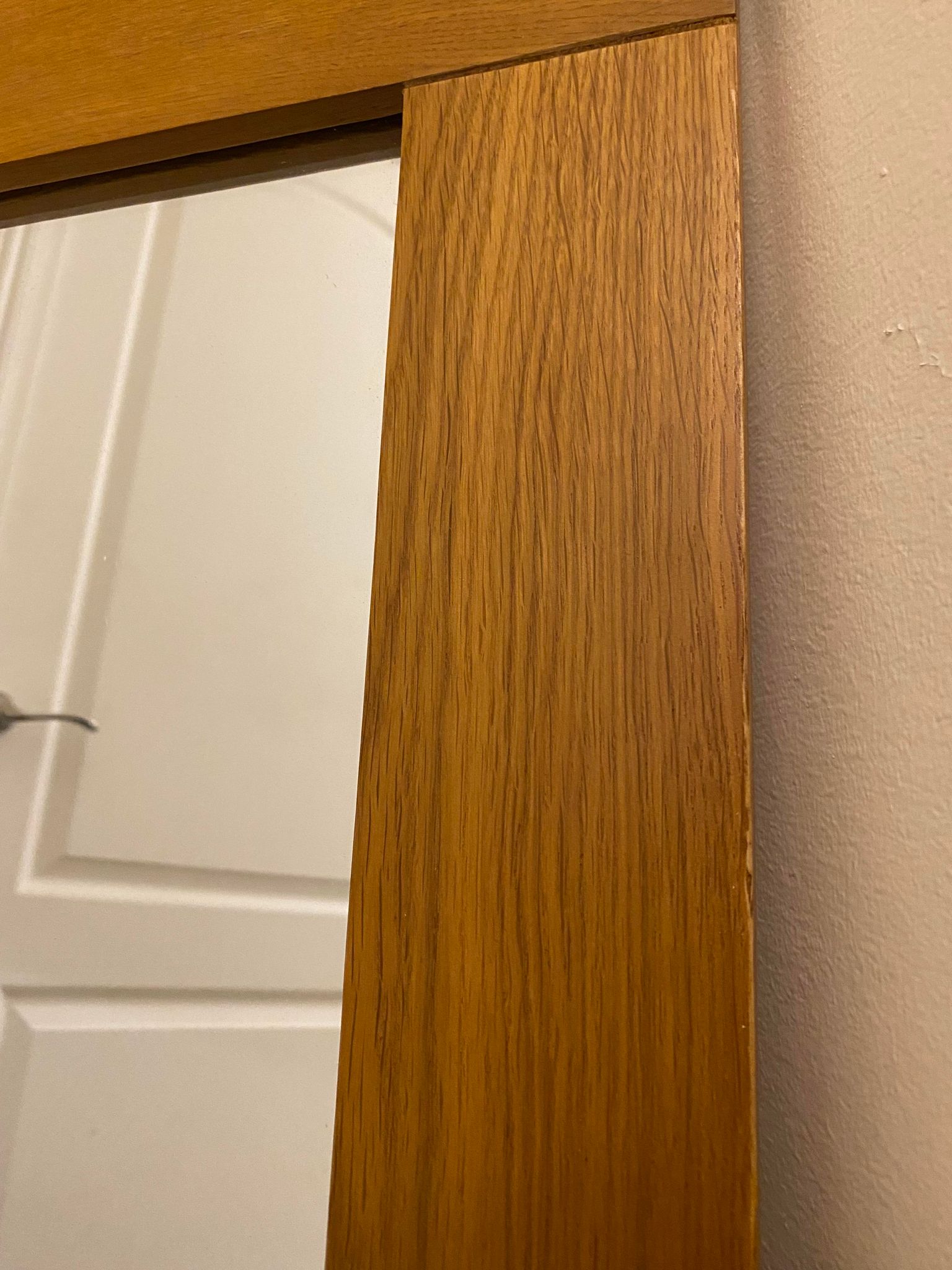 Solid oak frame around a mirror.