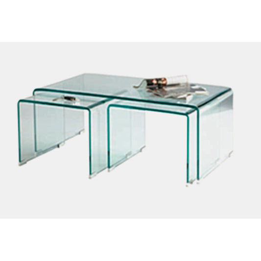 Set of three clear glass nesting tables on a white background
