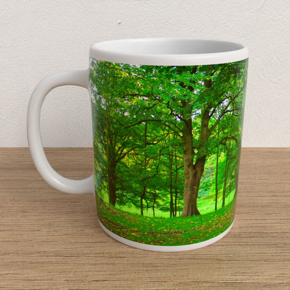 Mug with a forest design on a wooden surface