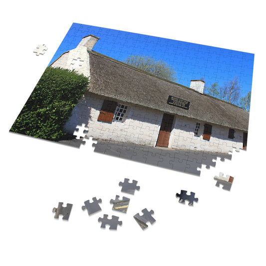 Jigsaw puzzle of a cottage with missing pieces on a white background