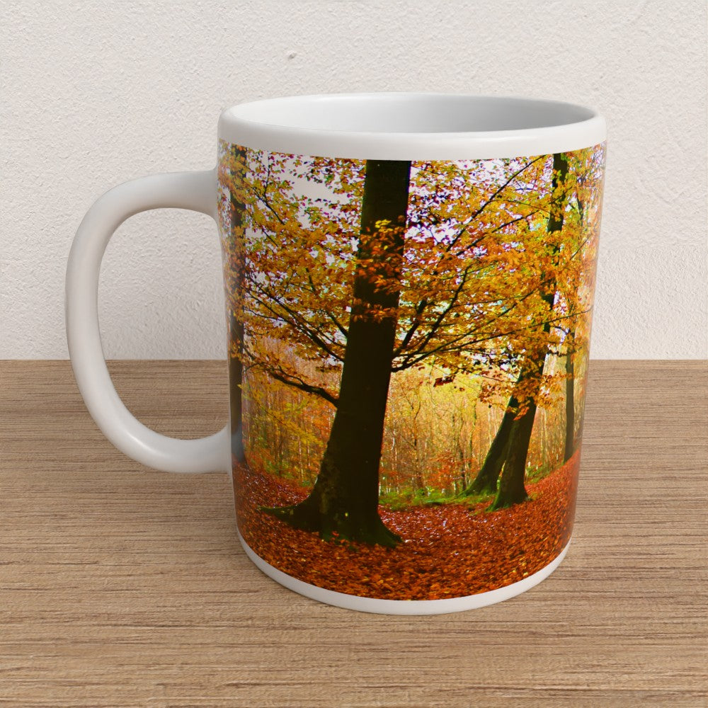 Mug with a design of autumn trees on a wooden surface