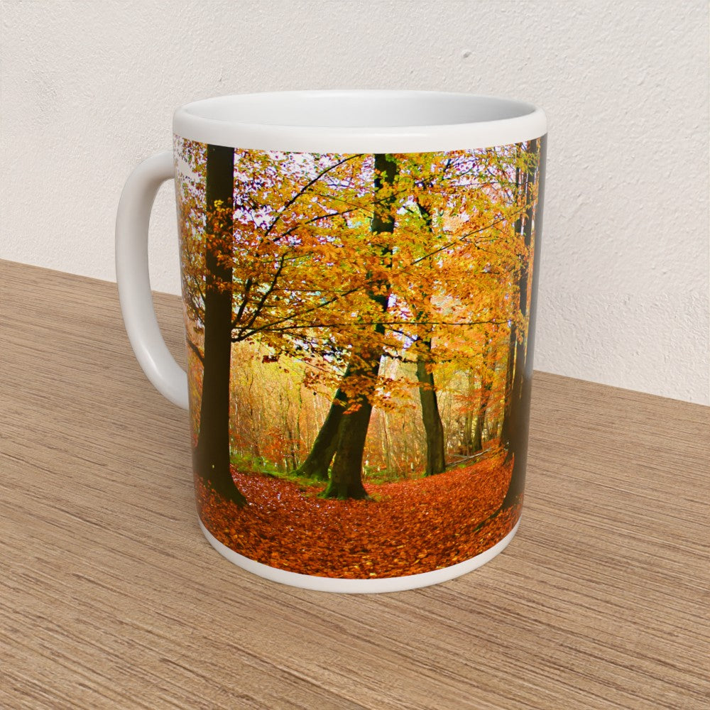 Mug with an autumn forest design on a wooden surface