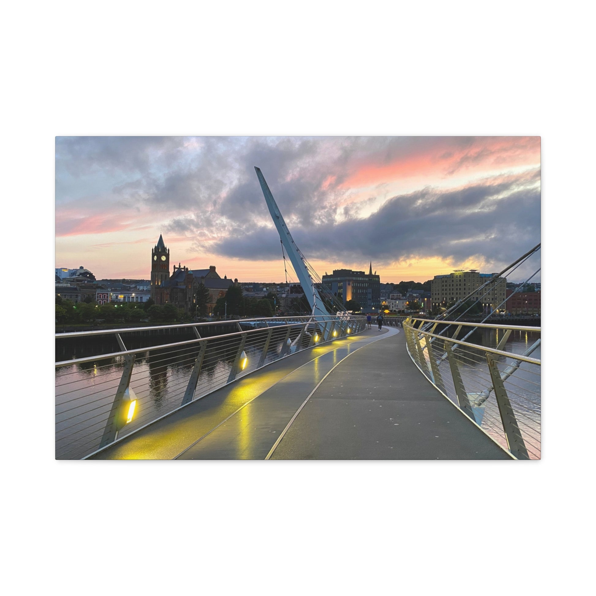 Modern bridge with a cityscape and sunset in the background