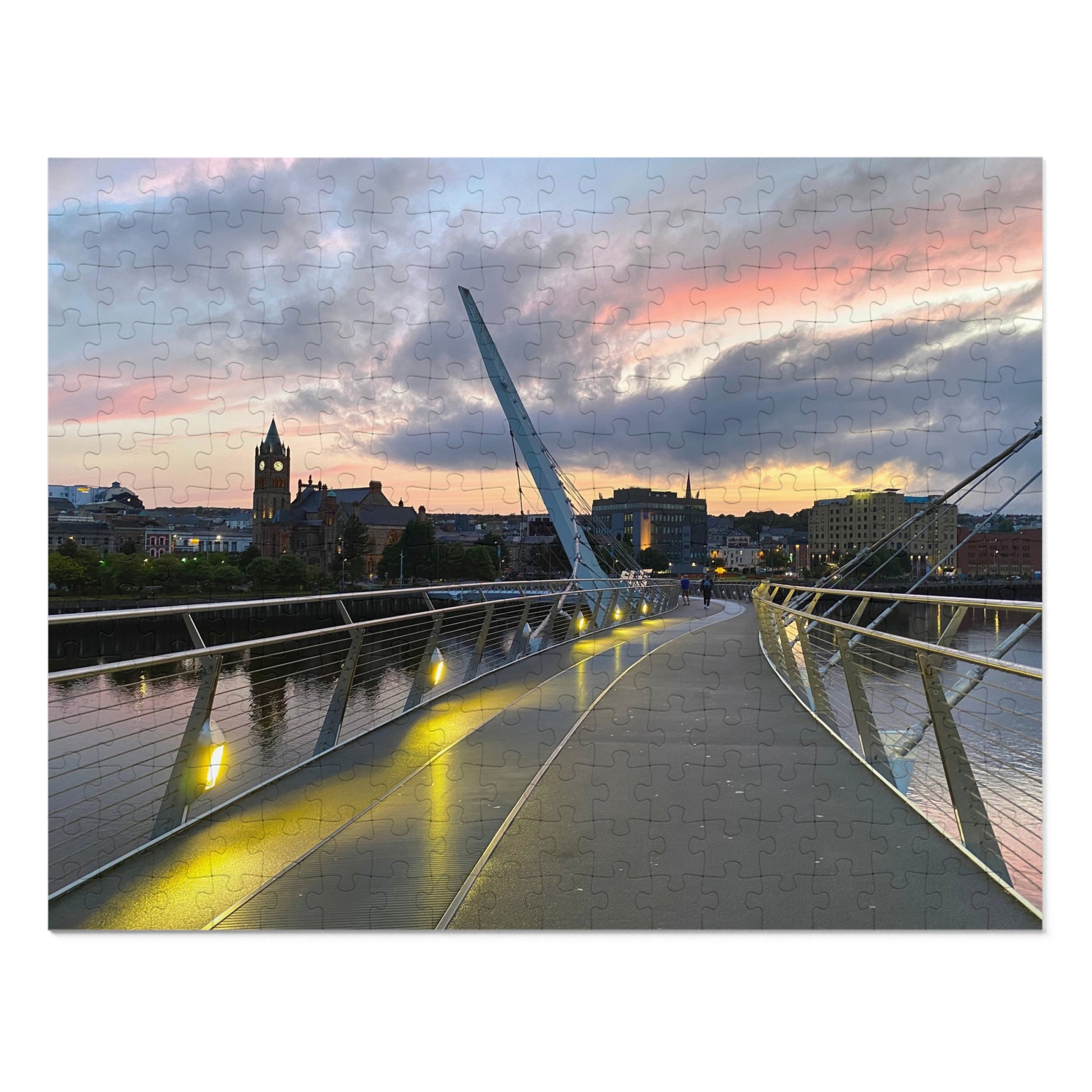 Modern bridge with a cityscape and sunset sky