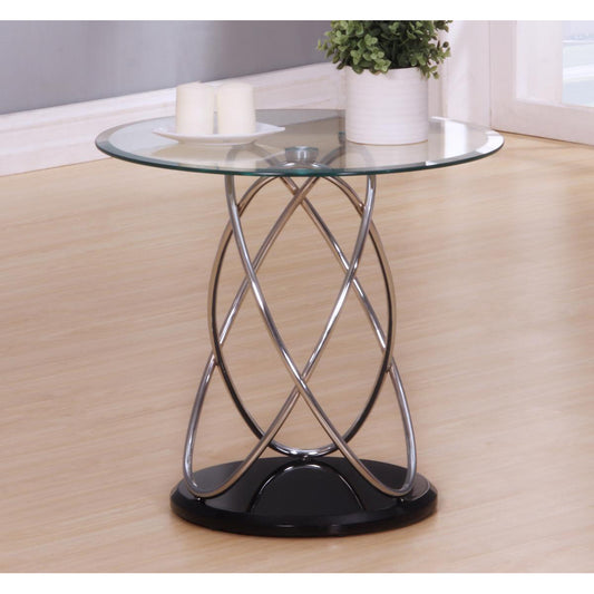 Glass side table with metal base on a wooden floor
