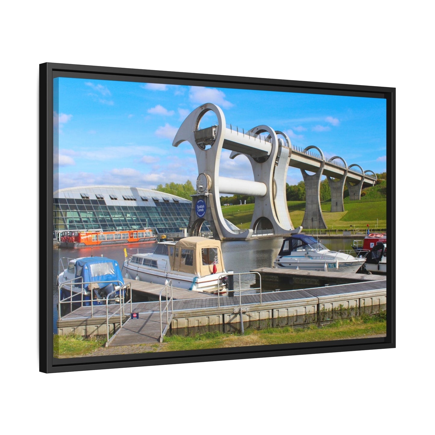 Falkirk Wheel boat lift with boats docked at a pier, framed as a picture.
