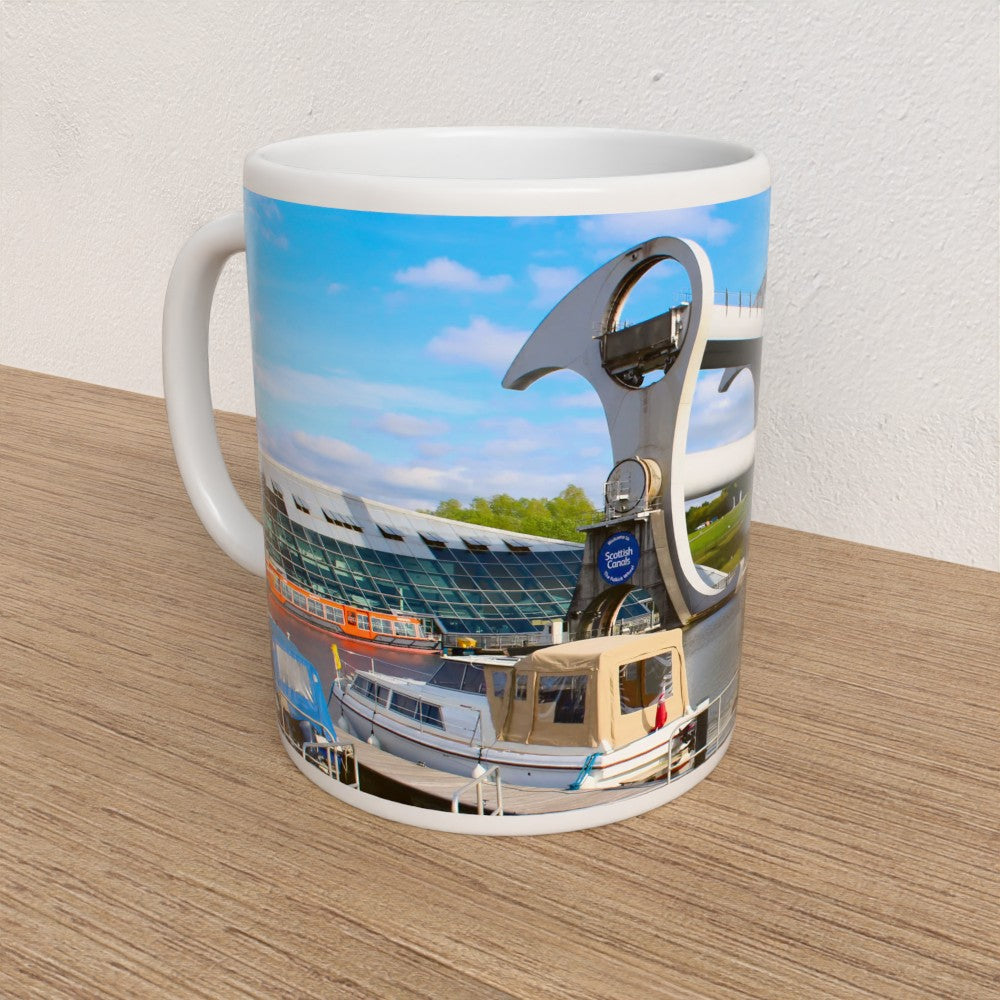 Mug with a design of the Falkirk Wheel on a wooden surface.