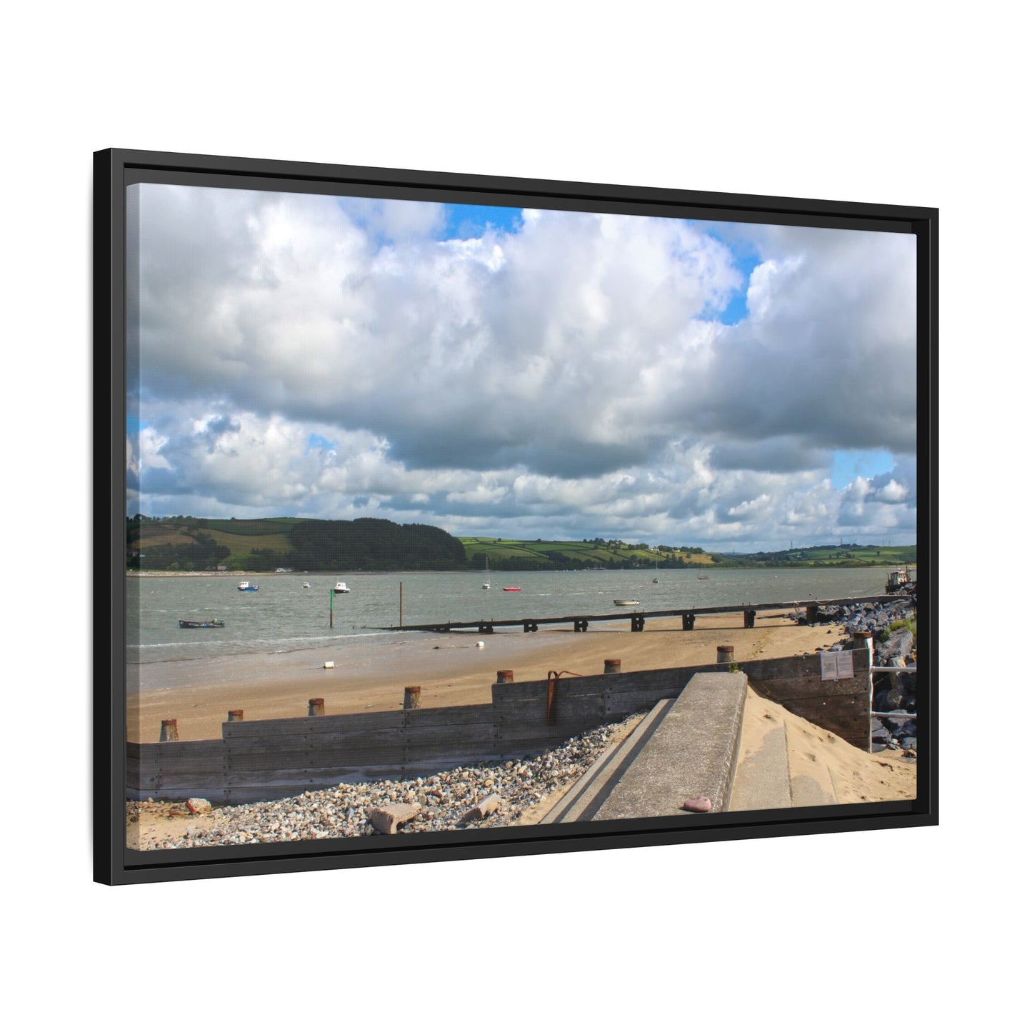 Framed picture of a coastal scene with a beach, sea, and sky.