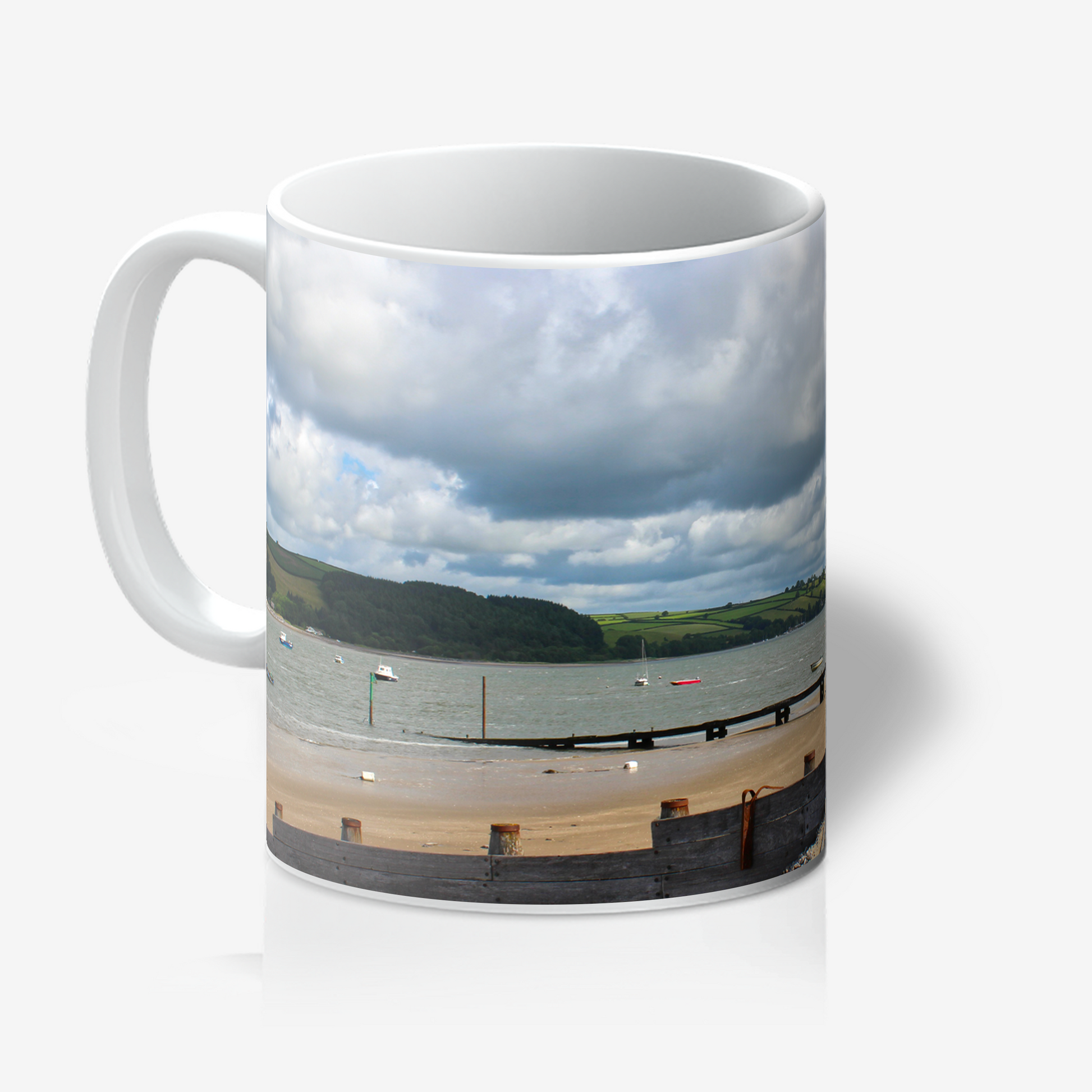 Mug with a scenic coastal view on a white background