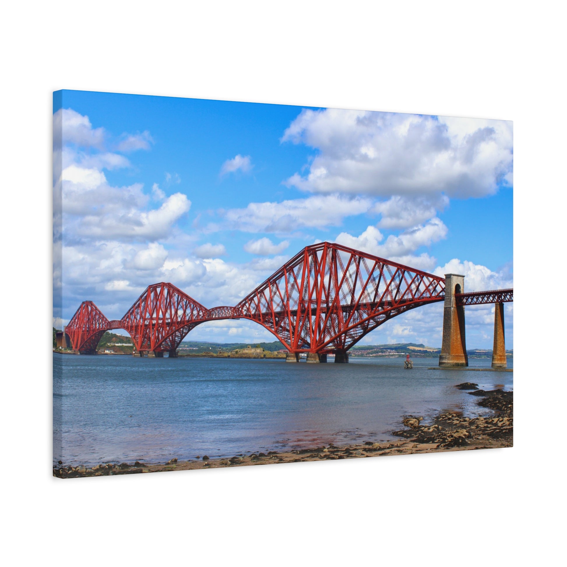 Red bridge over water with blue sky and clouds