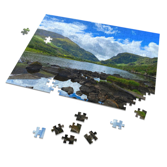 Jigsaw puzzle with a scenic view of a lake and mountains, some pieces missing.